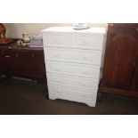 A modern white melamine chest fitted five long dra
