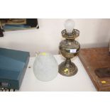 A brass oil lamp converted to electricity with mot