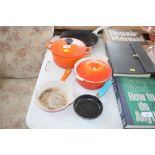 A cast iron pan together with three items of Le Cr