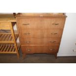 A teak effect chest fitted four drawers