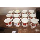 Twelve strawberry decorated mugs