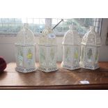 Four metal candle lanterns