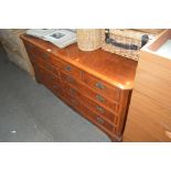 A reproduction walnut sideboard fitted nine drawer