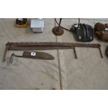 Cross cut saw and hay knife.