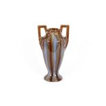 An Art Nouveau pottery baluster vase with running