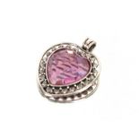 A white metal and pink stone heart shaped pendant