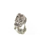 A white metal skull decorated dress ring