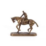 A bronzed figure of a horse and jockey