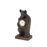 A Black Forest style bear clock