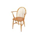 An Ercol stick back kitchen elbow chair