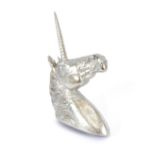Two decorative silvered unicorn heads