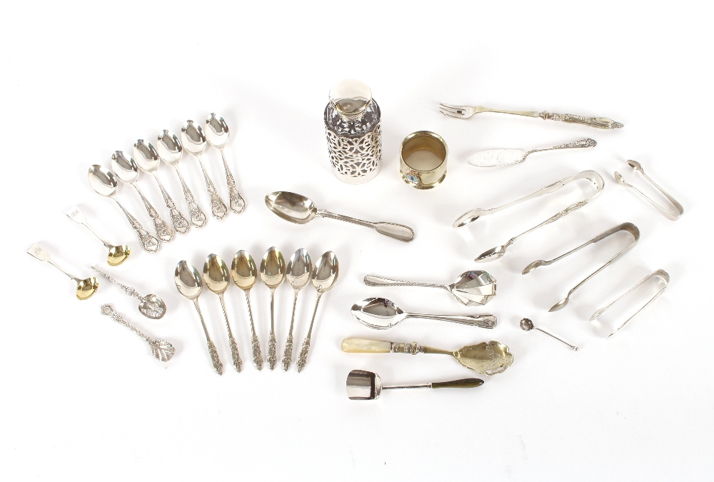 A collection of various silver and plated spoons,
