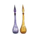 A pair of Italian coloured glass ornate decanters, in mauve