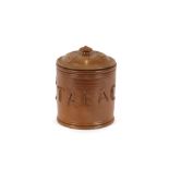 A brown glazed pottery "Tabac" jar and cover, with raised decoration, 19cm high