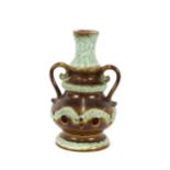 A large Continental pottery twin handled lamp base