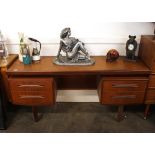 A teak G plan kneehole dressing table, fitt