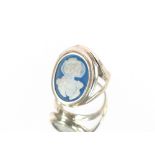 A white metal cameo ring