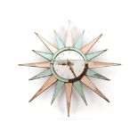 An Art Deco starburst mirrored wall clock AF