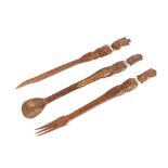 Three items of Ethnic carved wooden cutlery