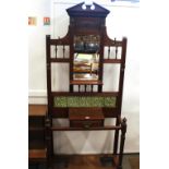 A late Victorian mahogany hall stand, with green g