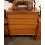 A teak G plan design four drawer chest, raised on