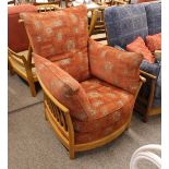 An Ercol light colour Renaissance armchair