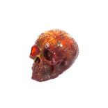 A decorative amber coloured scull