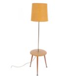 A retro standard lamp / coffee table raised on rou