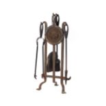 An iron companion stand with rose decoration and a