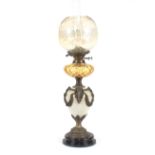 A pottery and brass mounted baluster table oil lamp, h