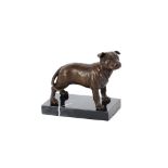 A bronze figure of a bulldog raised on marble plin