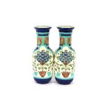 A pair of Burmantofts "Faience" baluster vases ric
