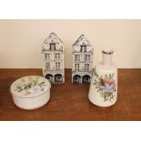 A pair of blue and white china storage boxes on th
