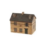 A tea caddy in the form of a house