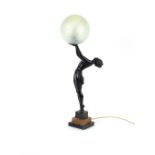 An Art Deco bronze table lamp, in the form of a se
