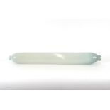 A large opalescent glass rolling pin, 79cm long