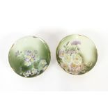 A pair of French porcelain wall plaques with flora