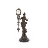 An Art Nouveau style swinging clock, in the form o