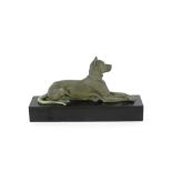 An Art Deco bronzed study of a recumbent dog, sign