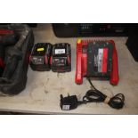 Three Milwaukee Lithium Ion batteries and charger