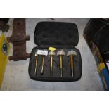 A set of cased router bits