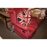 A red upholstered wing back armchair