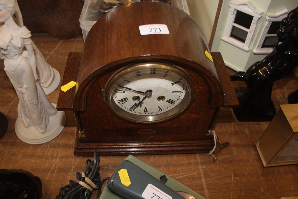 A two hole mantel clock with key