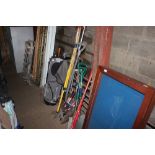 A quantity of long handled gardening tools etc.