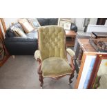 A Victorian mahogany button back arm chair