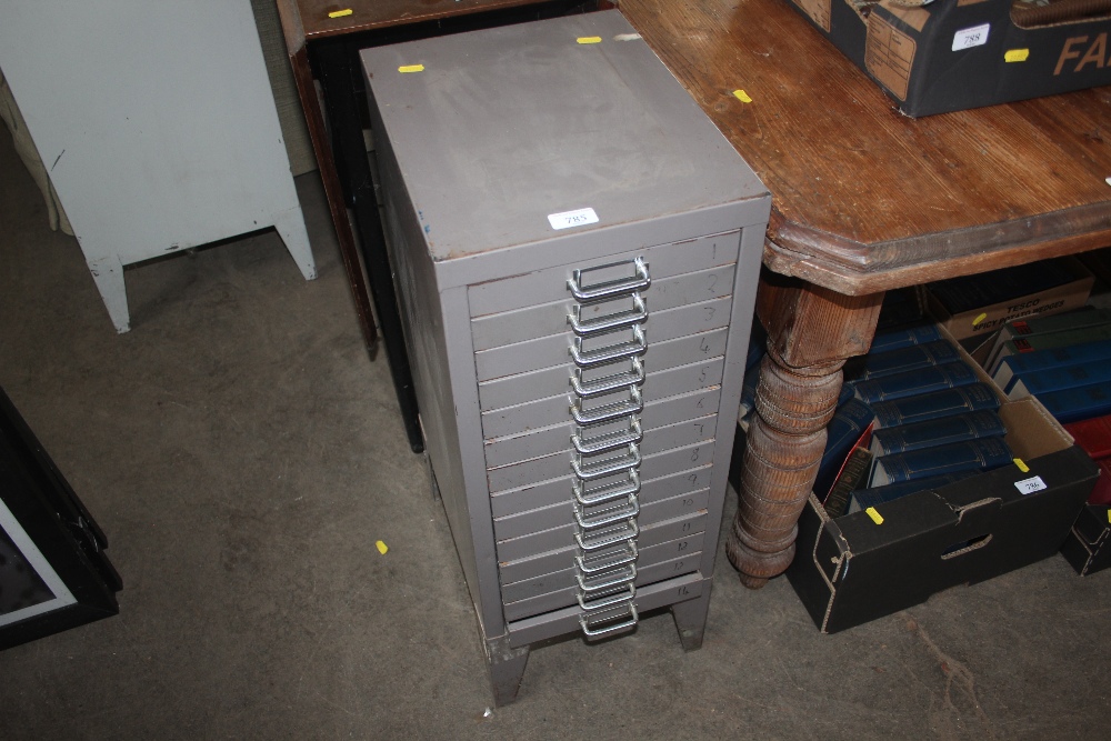 A metal multidrawer chest of narrow proportions