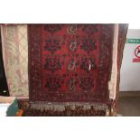 An approximate 6'7" x 4'1" Eastern patterned rug A