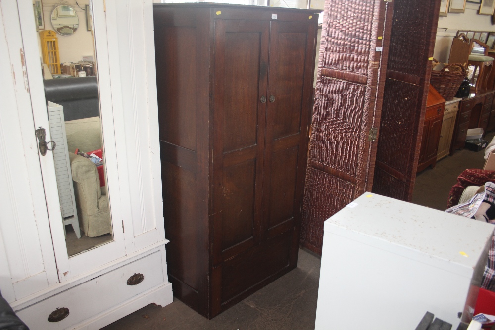 A mahogany two door cupboard