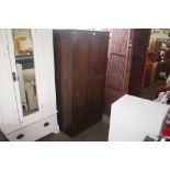 A mahogany two door cupboard