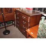 A reproduction chest fitted two short over three l